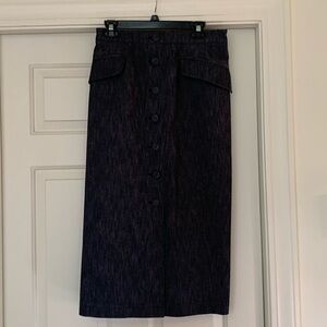 Carolina Herrera denim skirt. Zip up the back with bettons down front
